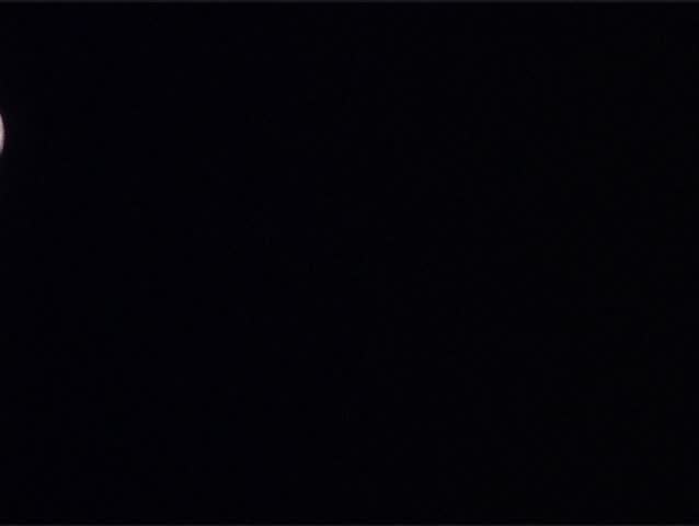 Moon with details of his surface is flowing on the night clear sky.