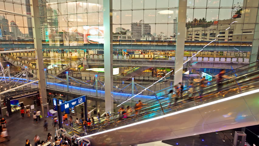 BANGKOK - MARCH 31: (Time lapse view) People taking escalators at Terminal 21 on