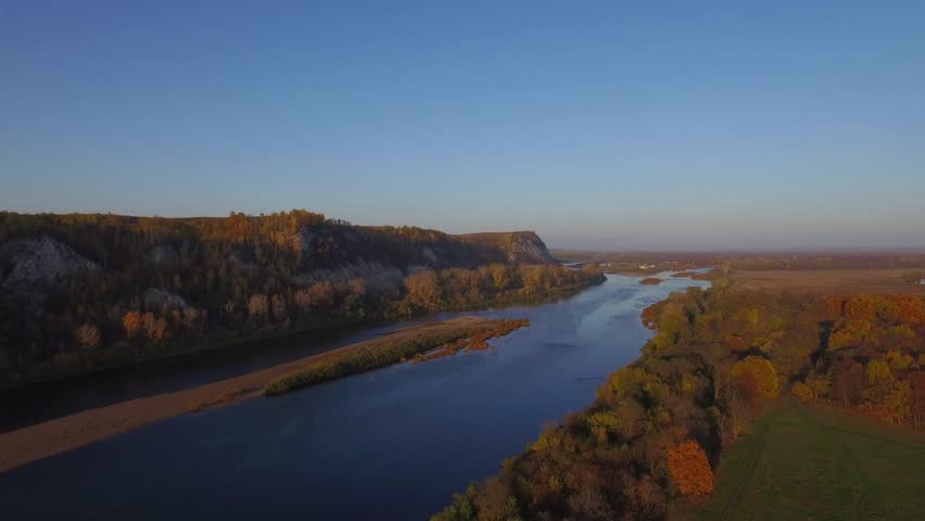 aerial view on mountain broad river autumn forest under rock