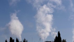 Video of pollution, smoke and steam discharged from a coal powered electrical generation facility in Spain. Contamination, pollution causing global warming and climate change
