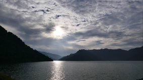 Movement of cloud at lake, time lapse.