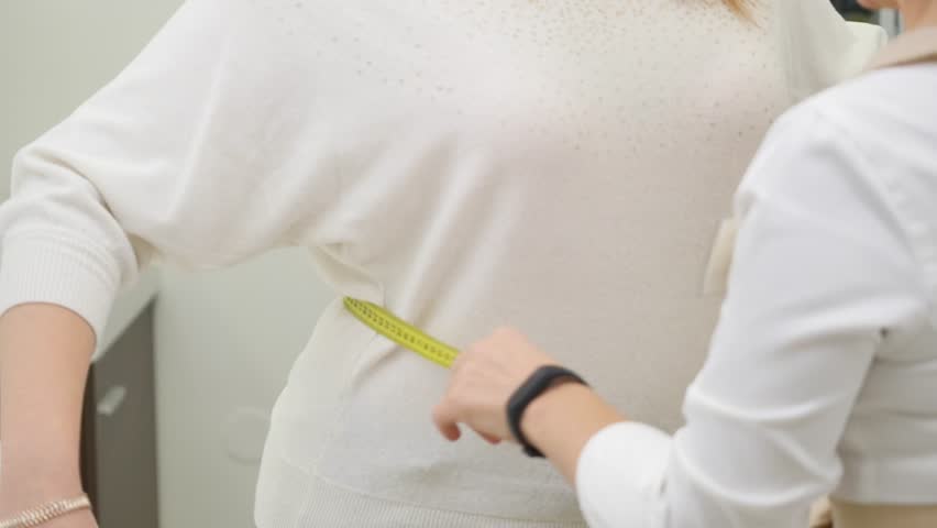 Doctor measuring obese woman waist body fat. Obesity and weight loss. Royalty-Free Stock Footage #21425281