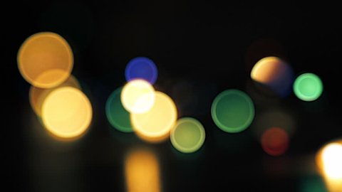 flicking abstract colorful bokeh, dark background