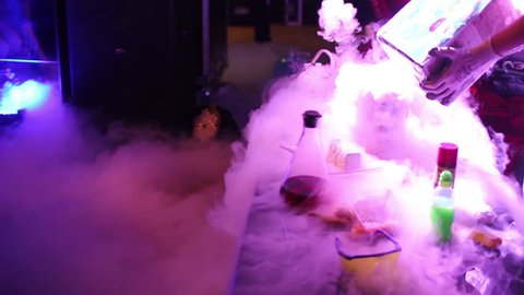 chemical show at the birthday party. thick white steam after chemical reaction