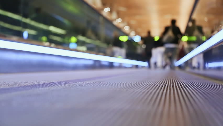 Moving sidewalk at an airport with people 2