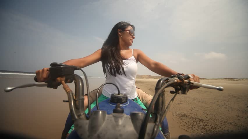 Woman On Quad At Beach