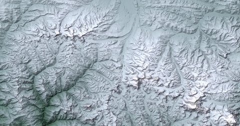 High-altitude overflight aerial of snow-covered Himalayas in Southern Tibet. Clip loops and is reversible. Elements of this image furnished by NASA 