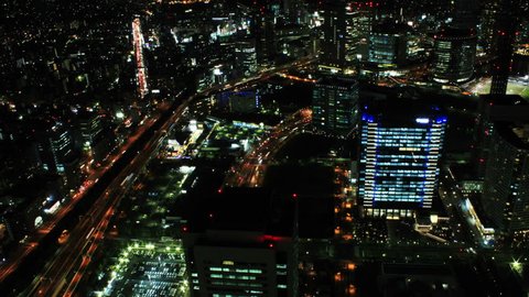 4K Aerial TimeLapse zoom of the futuristic looking Yokohama city, Japan, at night