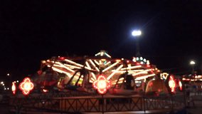 Blurred Amusement park ride at night. 