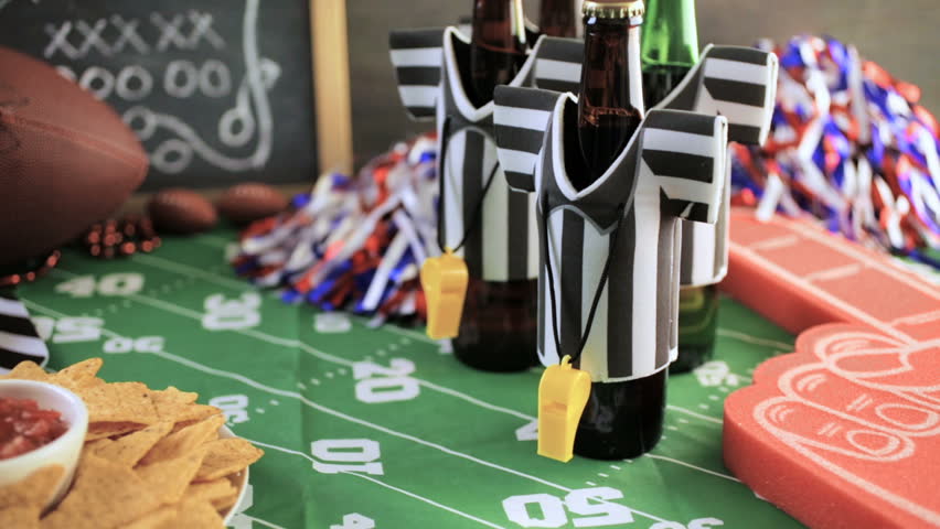 Game day football party table with beer, chips and salsa.