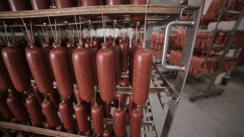 Sausages in the factory freezer storage. Ready, made meet ptoducts at a big food warehouse.