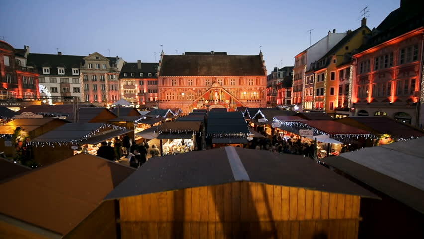 Aerial magic view from a Ferris wheel over Christmas Market with Cathedral Temple Saint-Etienne behind during best Christmas Market in French city of Mulhouse in Place de la Reunion drone Christmas