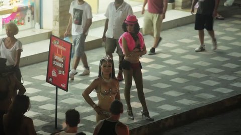 KOH SAMUI, THAILAND - NOVEMBER 9, 2014: A whore waiting for a customer on street in the evening