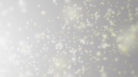 Soft beautiful grey backgrounds.Moving gloss particles on silver background loop. Winter theme Christmas background with snowflakes.