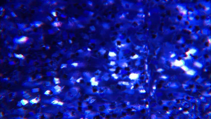 Distorted confetti in blue liquid
