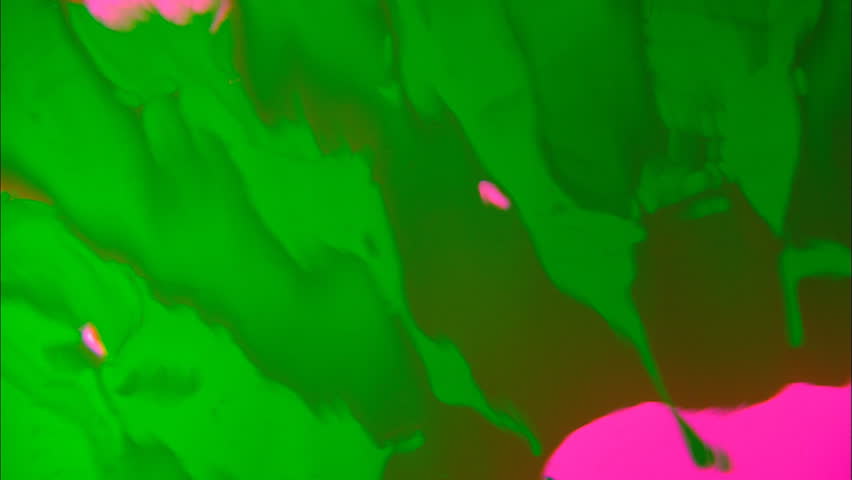 Distorted dripping green slime on pink background