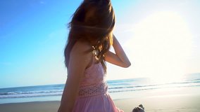 Portrait beach lifestyle ocean recreation leisure travel young Caucasian American girl smile romantic Summer holiday sunshine