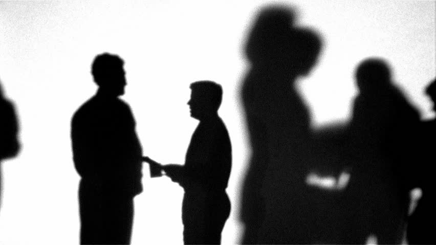 Silhouette of coworkers talking