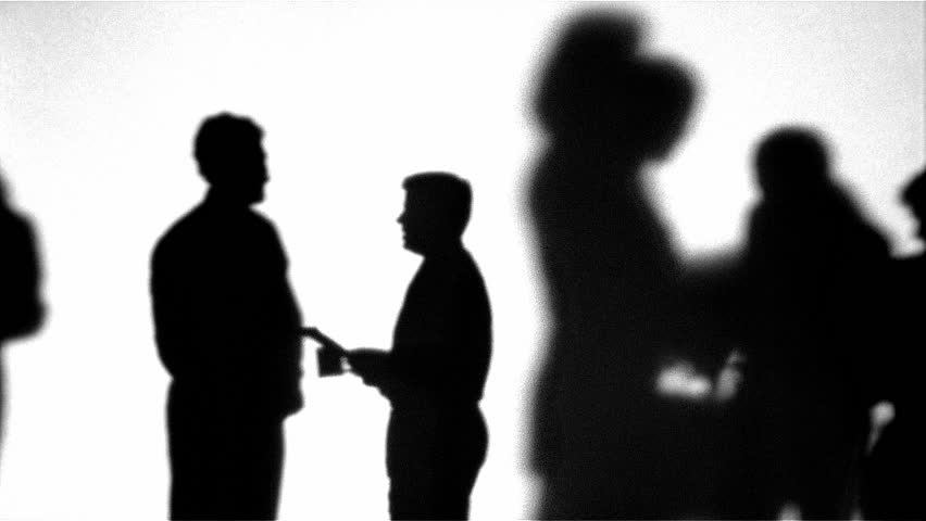 Silhouette of coworkers talking