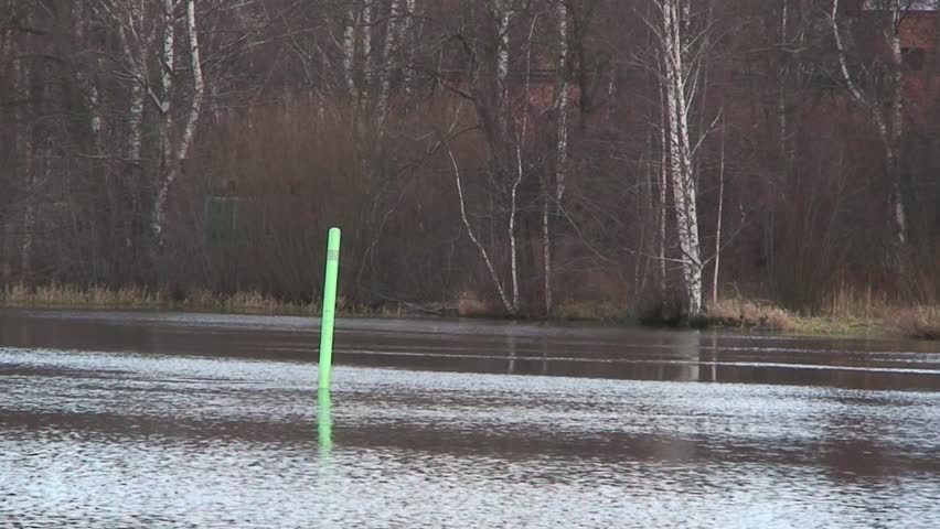 HDTV: Green buoy in a water