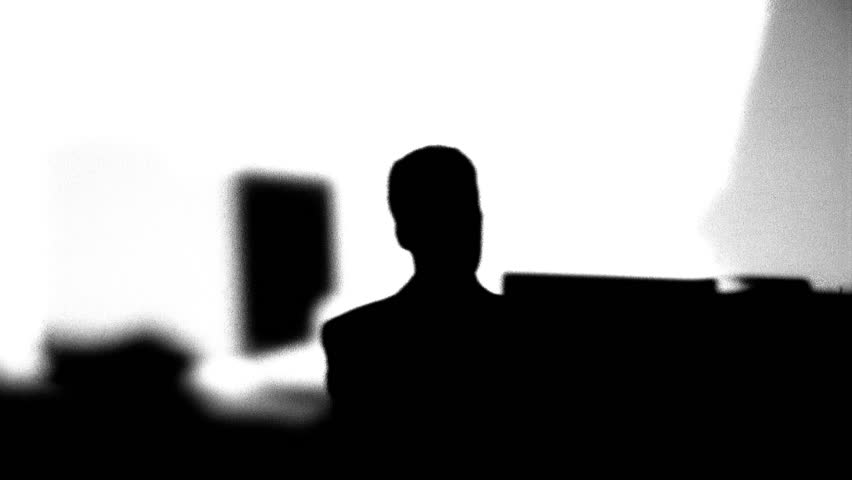 Silhouette of office workers typing