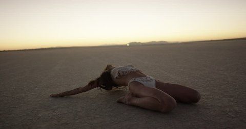 Exotic girl dancing in the desert