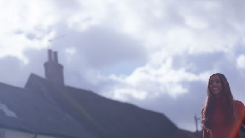 4K Happy couple meet and embrace outdoors on a sunny day (UK-Oct 2016)