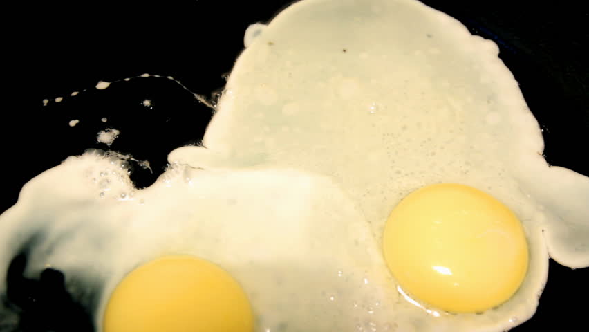 fried egg on black pan
