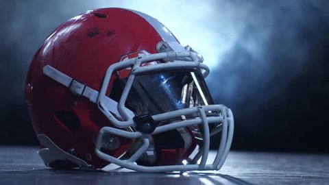 Helmet american football players in the smoke background. Clous up Stock Video