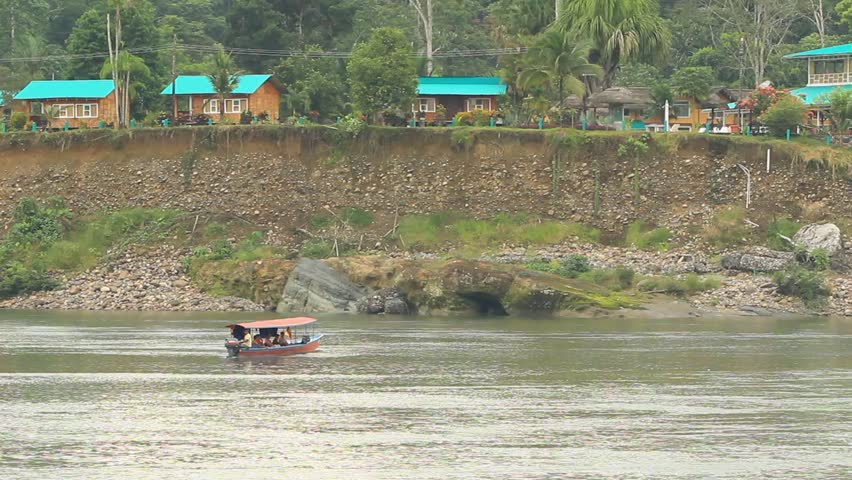 Motorized canoe with turists in the Ecuadorian Amazonia