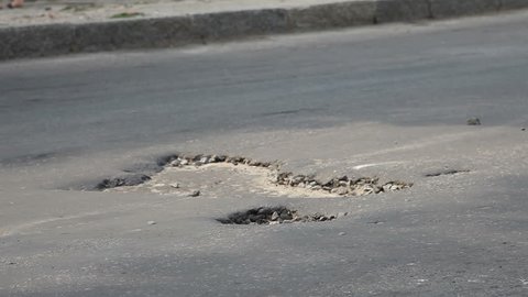 Potholes on the old highway in the city