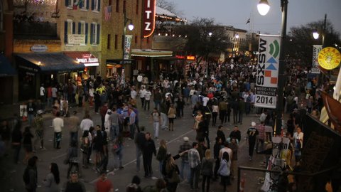 AUSTIN, TEXAS CIRCA MARCH 2014- Time lapse shot people walking at night on 6th Street during SXSW music festival 