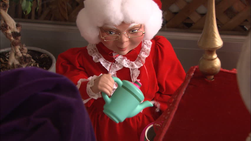 Mrs. Claus pouring tea