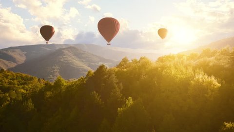Colourful Red Blue Yellow Colours Hot Air Baloons Aerial Drone Flight Over Beautiful Autumn Forrest at Sunet Mountains Beautiful Landscape Background Sunny Vacation Travel Destination Concept