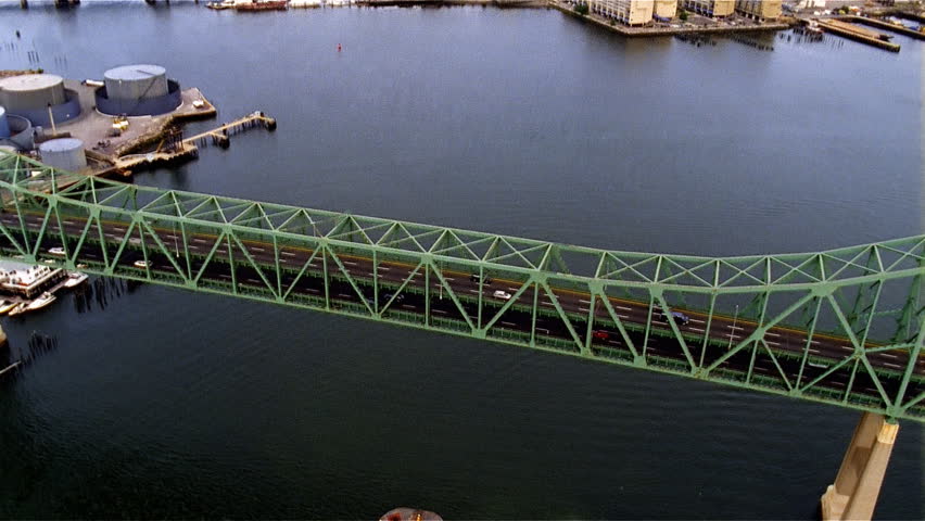 Aerial view long green bridge over river