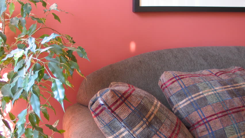 Time lapse of sunlight moving over sofa