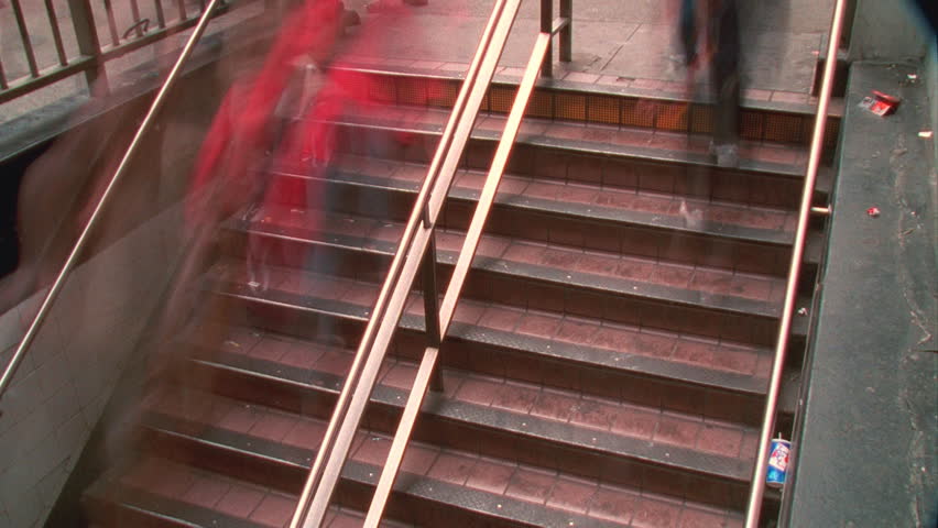 People blur on staircase