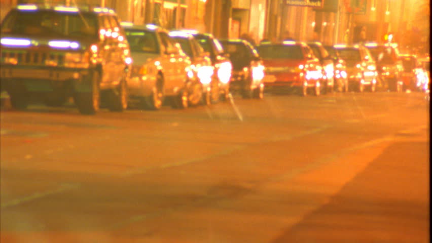 BOSTON - CIRCA 2003: Cars drive on a downtown Boston street circa 2003