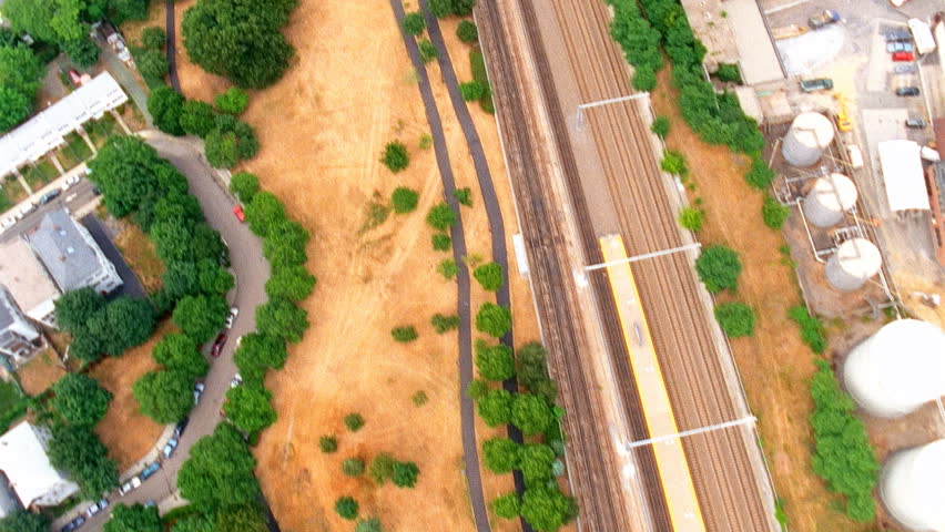 Aerial view of residential town and train tracks