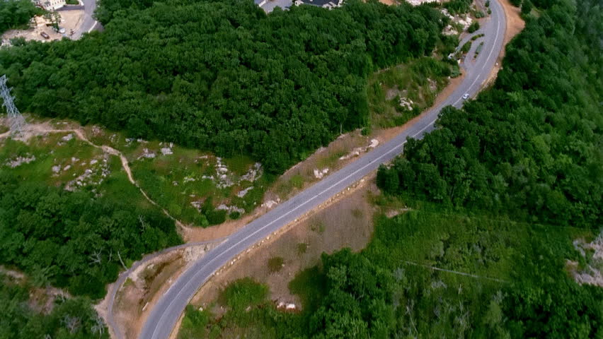 Aerial view of residential homes and forest