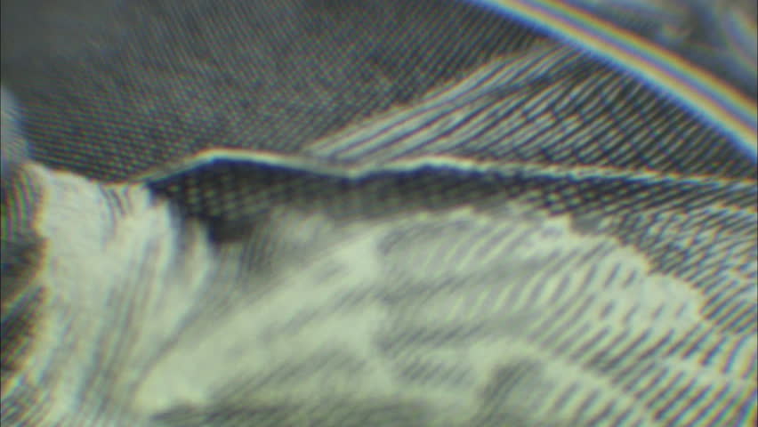 Rotating closeup of George Washington dollar bill