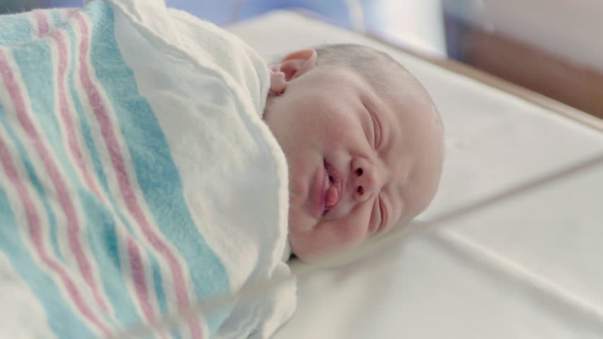 Close Up Newborn Baby Making Funny Faces in Bright Hospital Delivery Room | Shutterstock HD Video #21586525
