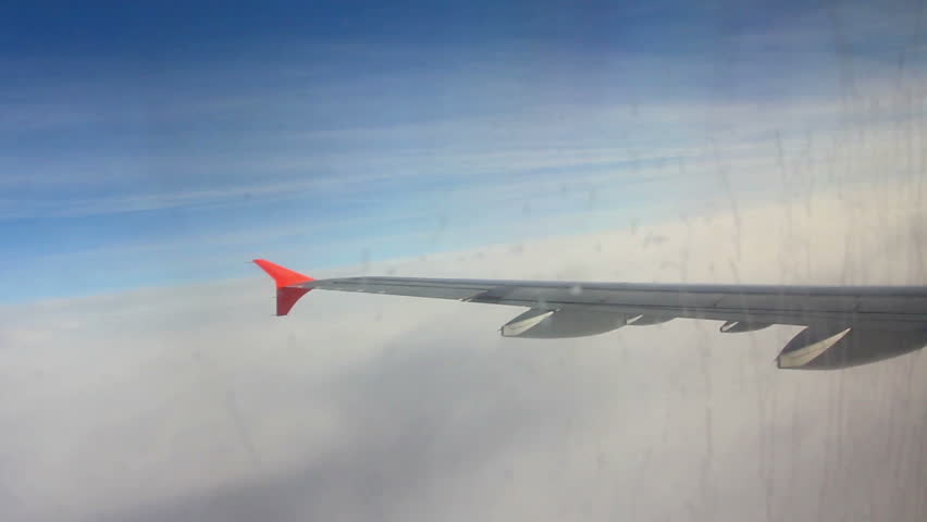 wing aircraft entering into the layer of clouds