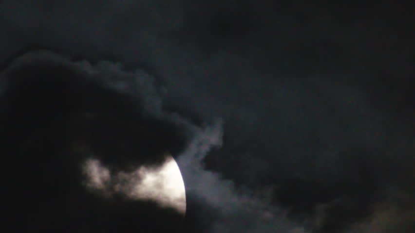 Full Moon rising on a cloudy spooky night