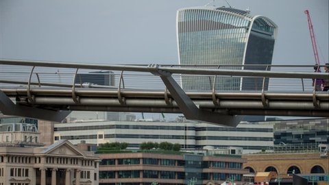 LONDON - AUGUST 2016 :  Timelapse of the Millennium Bridge spanning the river Thames, London. AUGUST 09, 2016