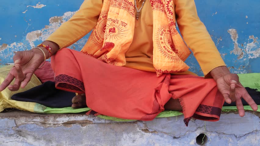 Tilt up to a Sadhu, Hindu holy man, in concentration and meditation with his eyes shut  Royalty-Free Stock Footage #21595768