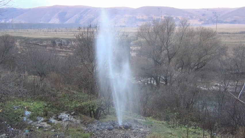Geyser on the river bank