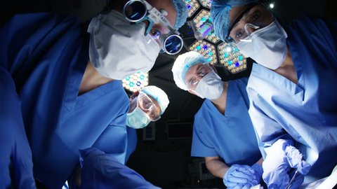4K Surgeons working on patient in operating room, seen from patient pov (UK-Oct 2016)