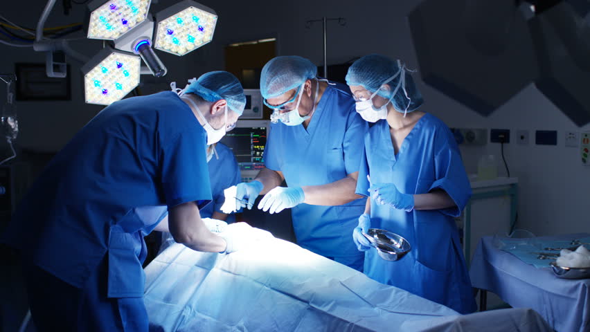 4K Team of surgeons in operating theater performing operation on a patient. (UK-Oct 2016) | Shutterstock HD Video #21598201