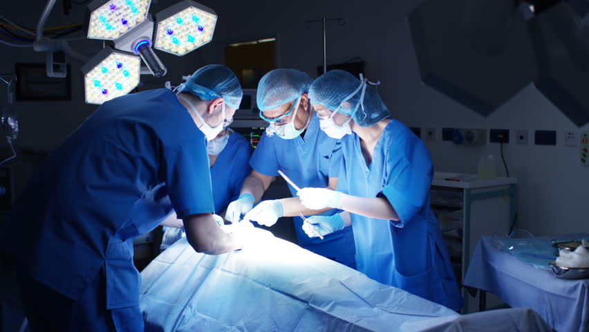 4K Team of surgeons in operating theater performing operation on a patient. (UK-Oct 2016) | Shutterstock HD Video #21598282
